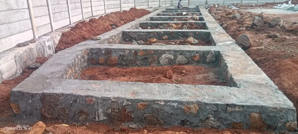 Stone wall foundation and footing work in progress